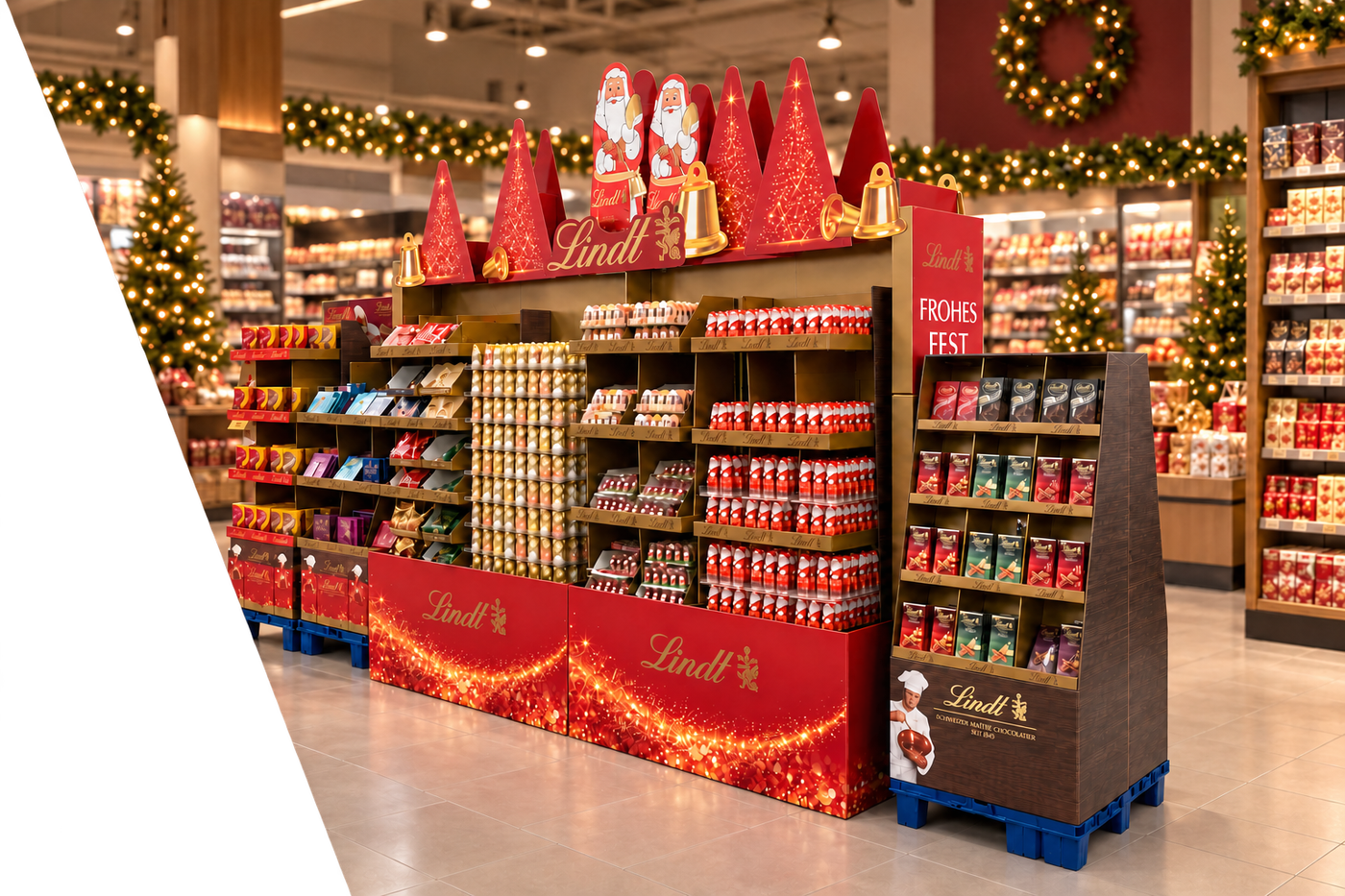 Lindt-kerstdisplay in sfeervolle supermarkt marketingbanner - Holbox Shop Direct v2