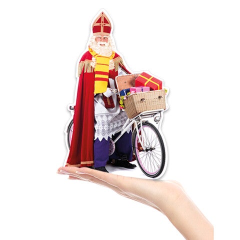 Mini cardboard Saint Nicholas on a bicycle